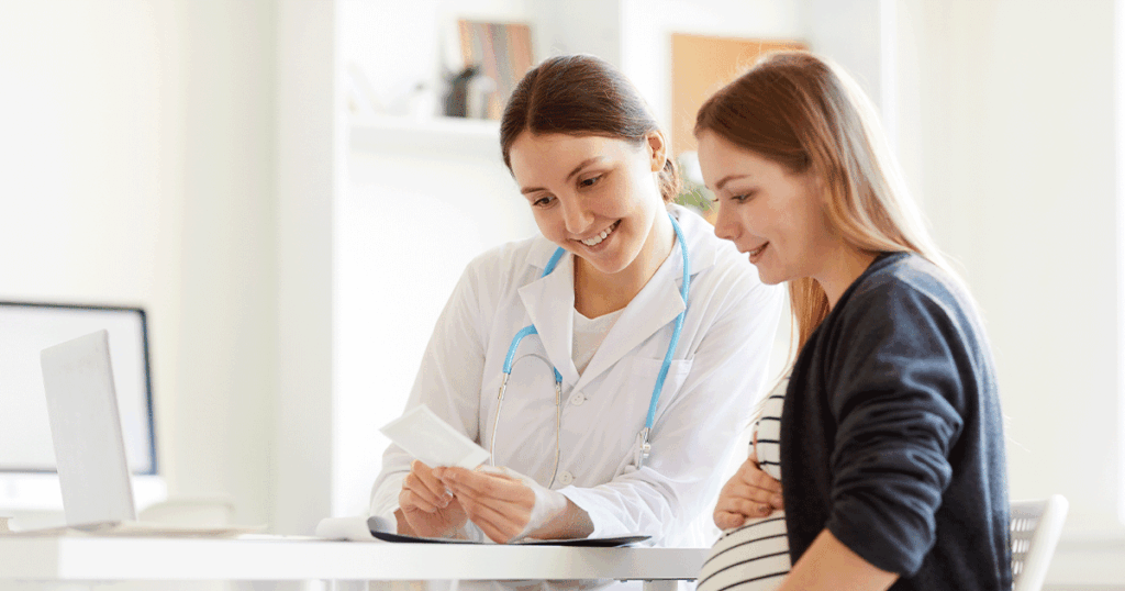 patient and dr. going over ultrasound results